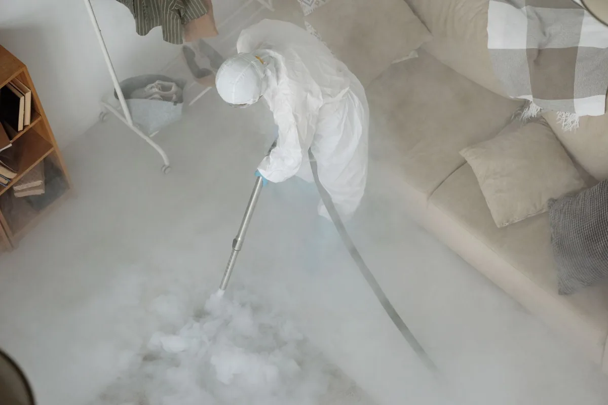 Biohazard cleanup technician in protective equipment, Britt, IA